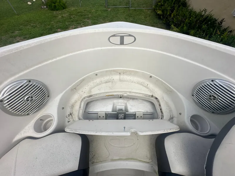 Slide: The Image of 2016 Tahoe 550 TS boat interior with speakers and storage compartment. - 12