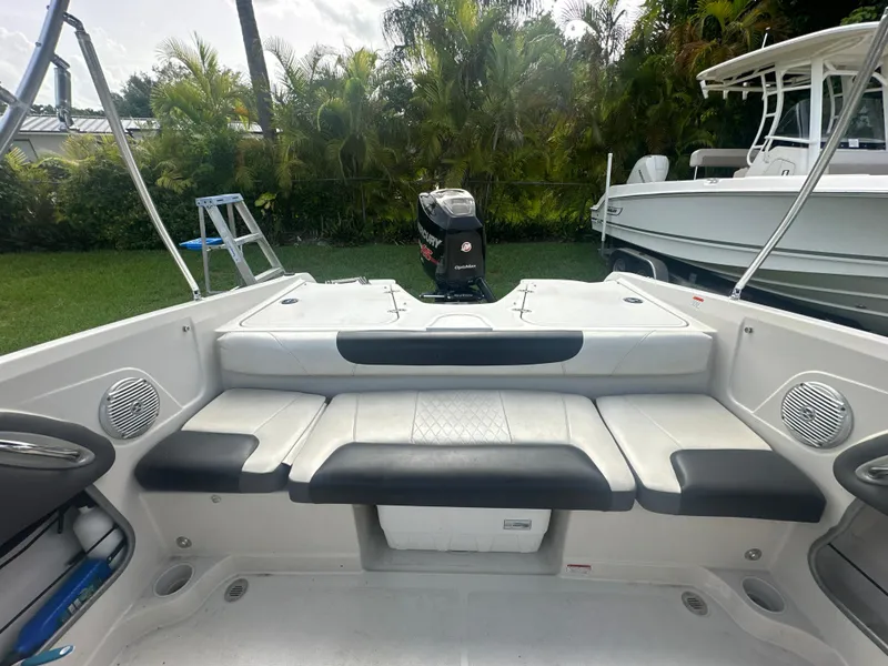 Slide: The Image of 2016 Tahoe 550 TS boat interior with seating and outboard motor. - 13