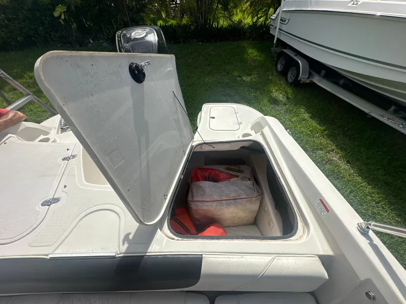 Slide: The Image of 2016 Tahoe 550 TS boat with open storage compartment. - 15