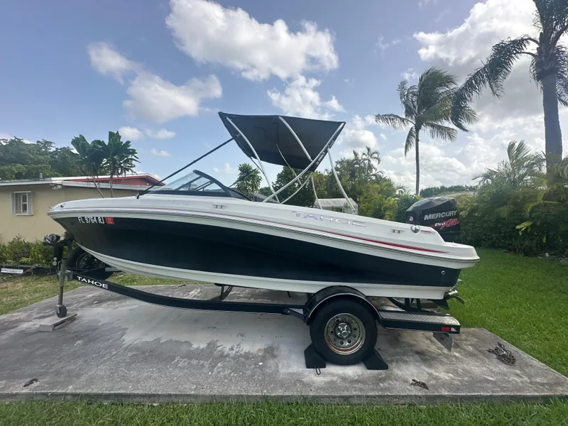 Slide: The Image of 2016 Tahoe 550 TS boat on trailer with palm trees in background. - 5