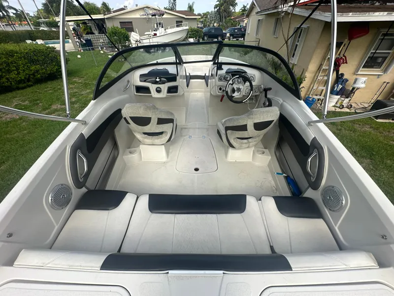 Slide: The Image of 2016 Tahoe 550 TS boat interior with seating and steering wheel. - 7