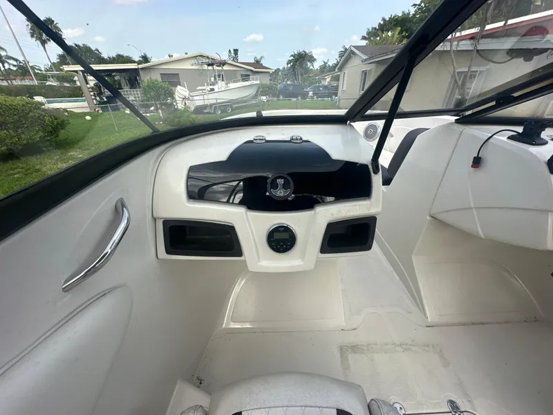 Slide: The Image of 2016 Tahoe 550 TS boat interior dashboard with steering wheel and controls. - 9