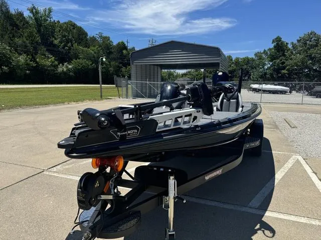 Slide: The Image of 2025 Phoenix Bass Boats 721 ZXL parked outdoors on a sunny day. - 13