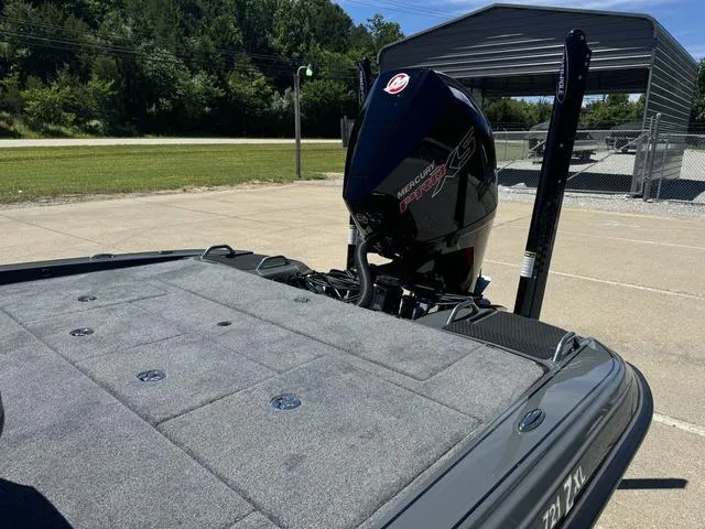 Slide: The Image of 2025 Phoenix Bass Boats 721 ZXL with Mercury Pro XS engine in parking lot. - 16