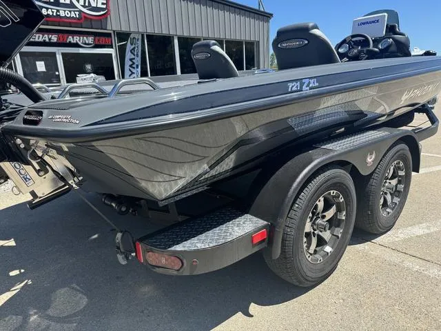 Slide: The Image of 2025 Phoenix Bass Boats 721 ZXL, black and gray, on trailer, outside dealership. - 4