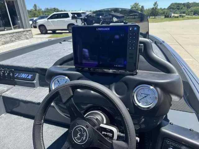 Slide: The Image of 2025 Phoenix Bass Boats 721 ZXL dashboard with Lowrance HDS display and gauges. - 7