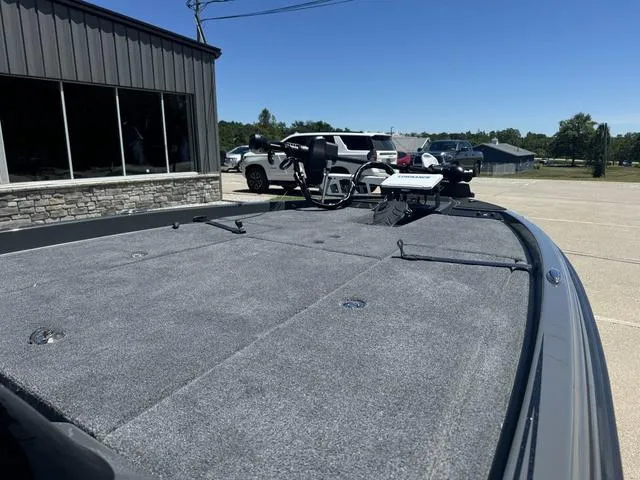 Slide: The Image of 2025 Phoenix Bass Boats 721 ZXL, spacious deck, parked outdoors. - 8