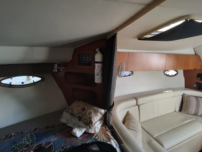 Slide: The Image of Interior cabin of a 1994 Tiara Yachts 3100 Open with seating and portholes. - 10