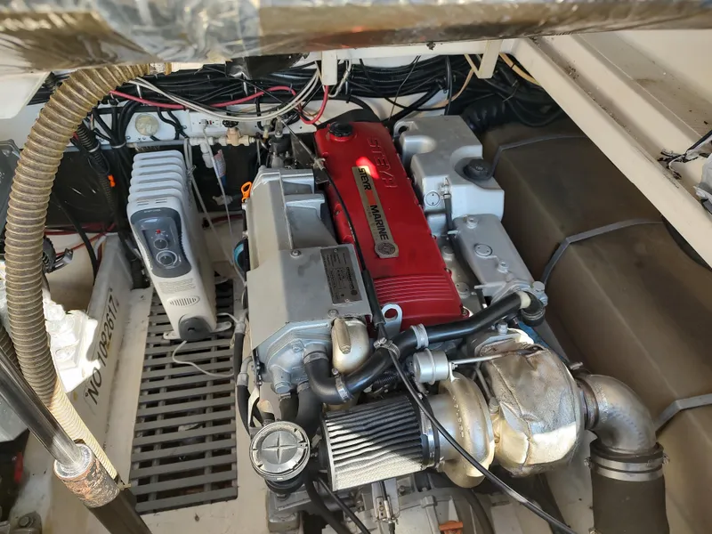 Slide: The Image of 1994 Tiara Yachts 3100 Open engine compartment with Steyr Marine engine. - 12