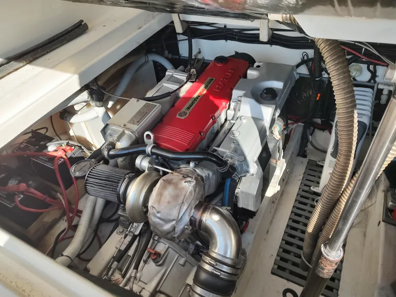 Slide: The Image of Engine compartment of a 1994 Tiara Yachts 3100 Open boat. - 13