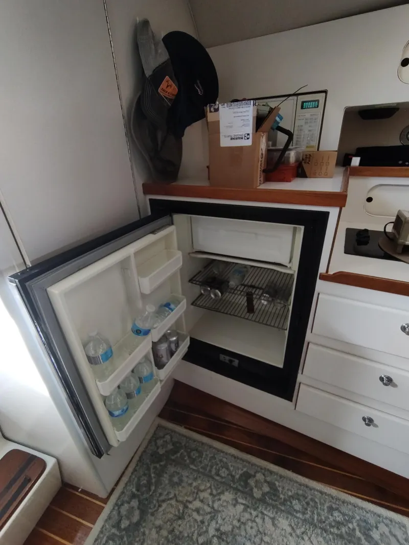 Slide: The Image of Open refrigerator in the cabin of a 1994 Tiara Yachts 3100 Open boat. - 9