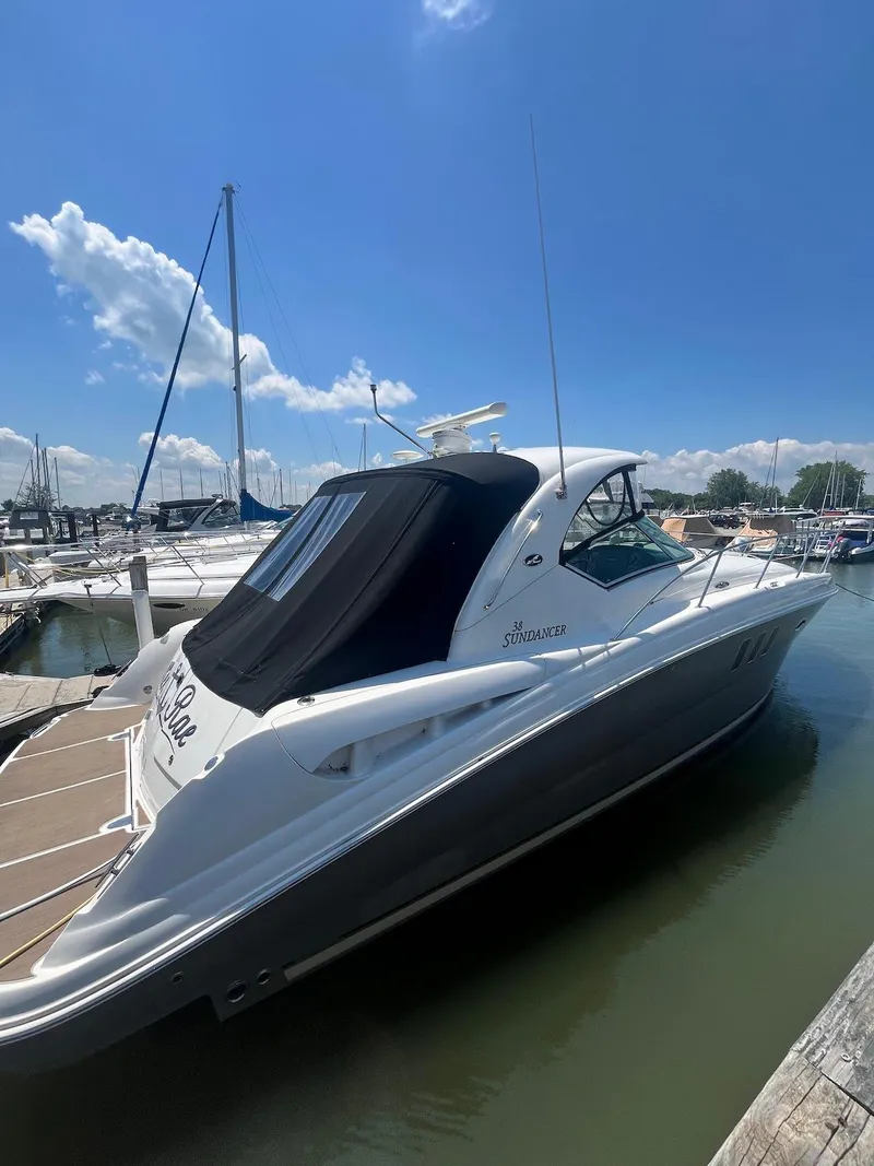 Slide: The Image of 2006 Sea Ray 38 Sundancer yacht docked at marina on a sunny day. - 1