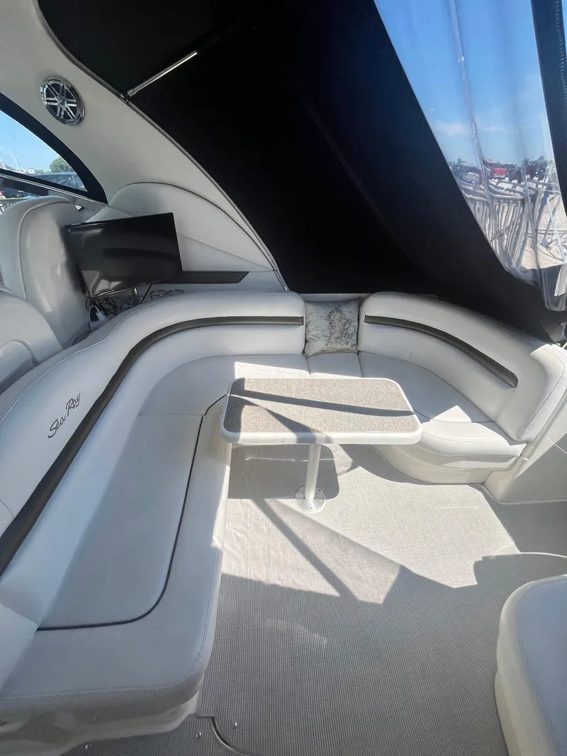 Slide: The Image of Interior of 2006 Sea Ray 38 Sundancer yacht with seating and table. - 10