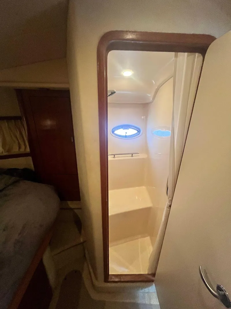 Slide: The Image of 2006 Sea Ray 38 Sundancer cabin shower with porthole window. - 21