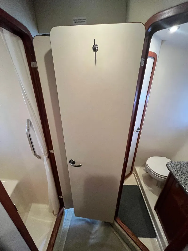 Slide: The Image of Bathroom interior of a 2006 Sea Ray 38 Sundancer yacht. - 22