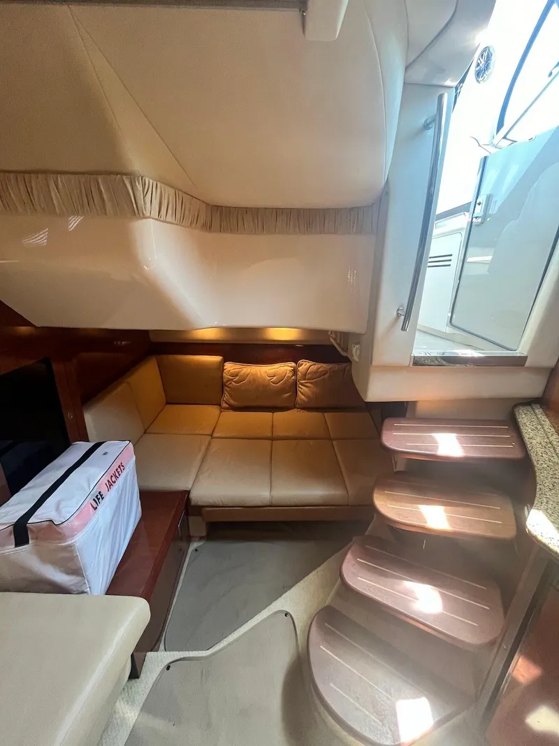 Slide: The Image of Interior of 2006 Sea Ray 38 Sundancer yacht with cozy seating area. - 25