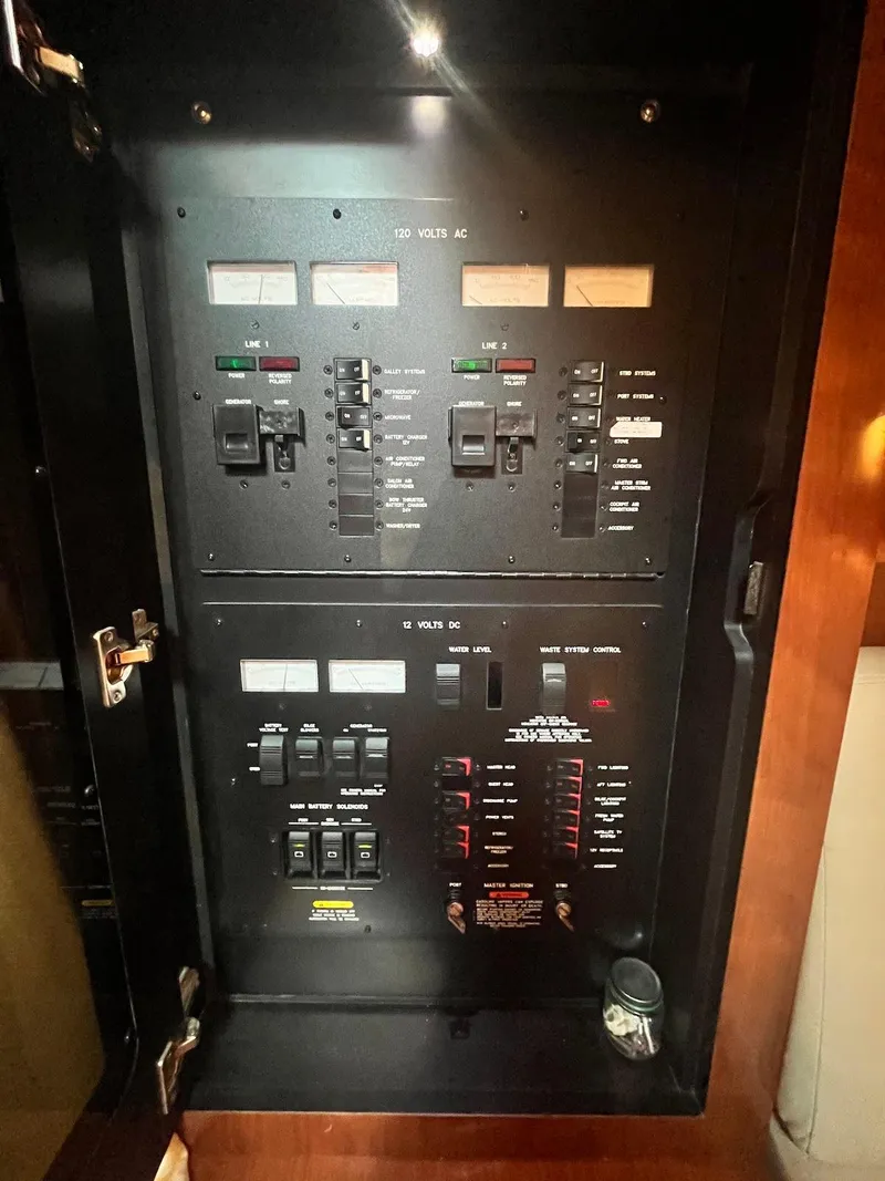 Slide: The Image of Electrical control panel of a 2006 Sea Ray 38 Sundancer boat. - 26