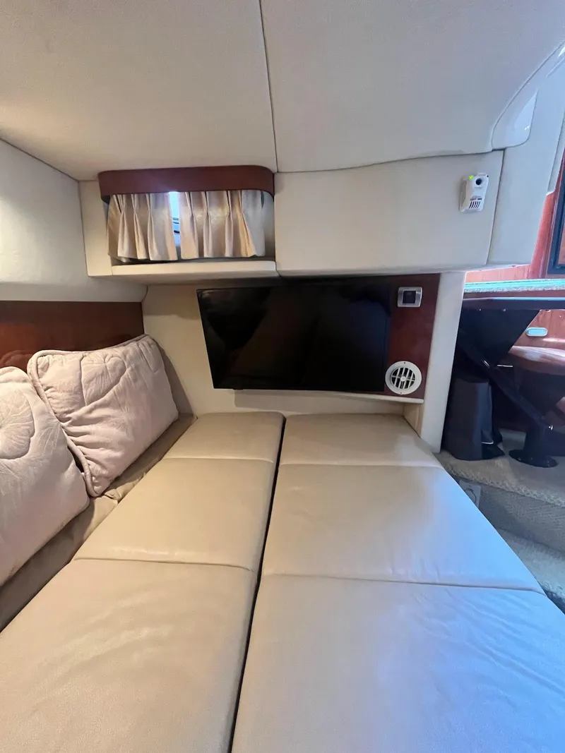 Slide: The Image of Interior cabin of a 2006 Sea Ray 38 Sundancer yacht with a TV and seating area. - 28