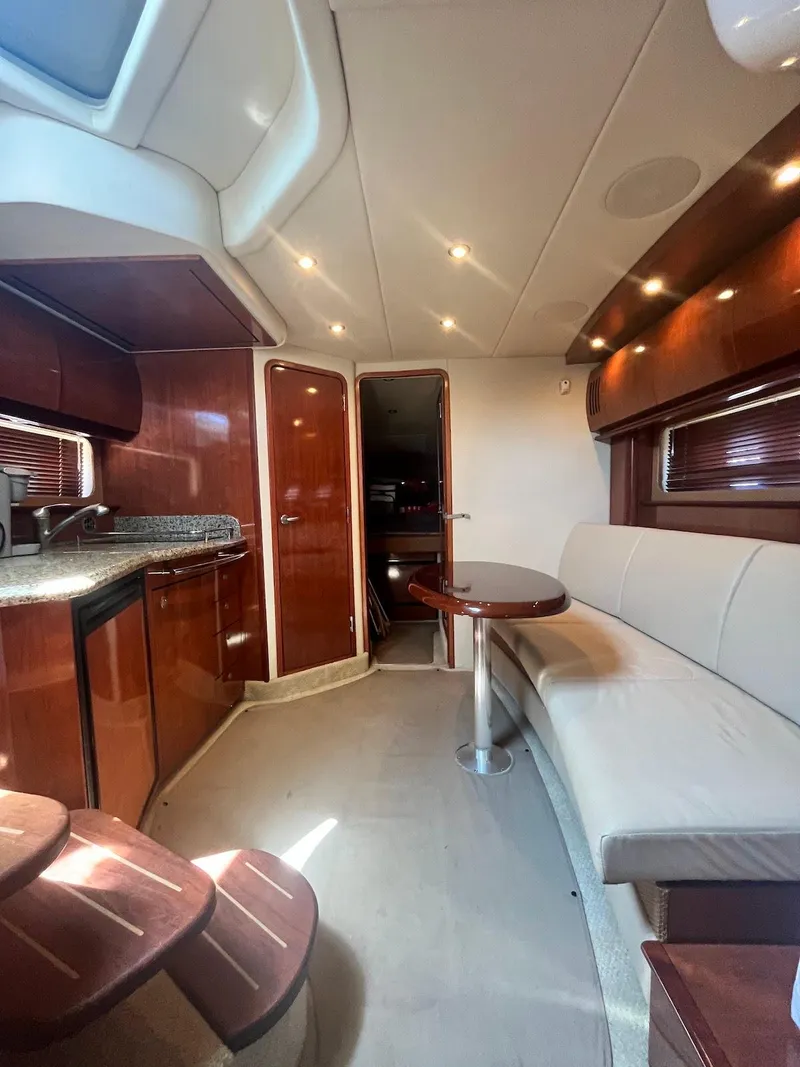 Slide: The Image of Interior of 2006 Sea Ray 38 Sundancer yacht with modern kitchen and seating area. - 29