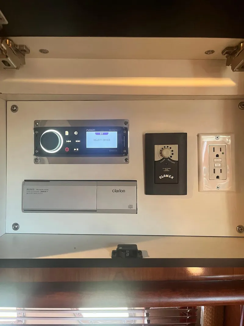 Slide: The Image of Control panel and outlets inside a 2006 Sea Ray 38 Sundancer yacht. - 30