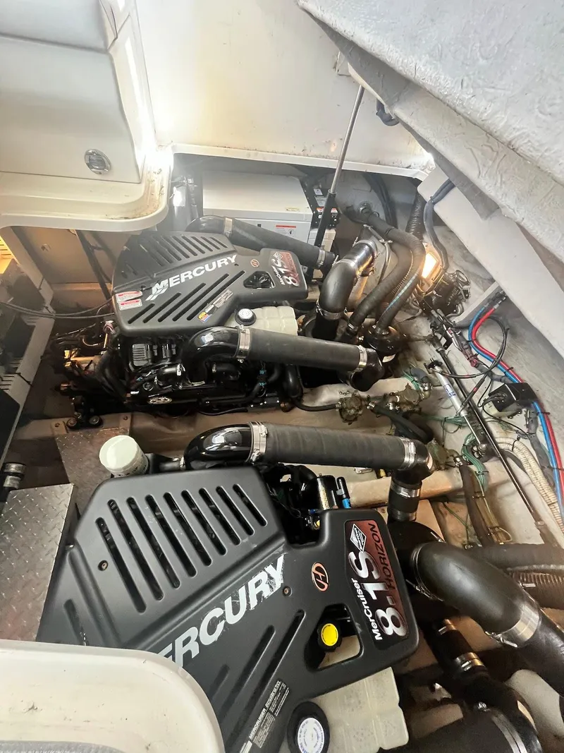 Slide: The Image of 2006 Sea Ray 38 Sundancer engine room with twin Mercury 8.1S engines. - 33