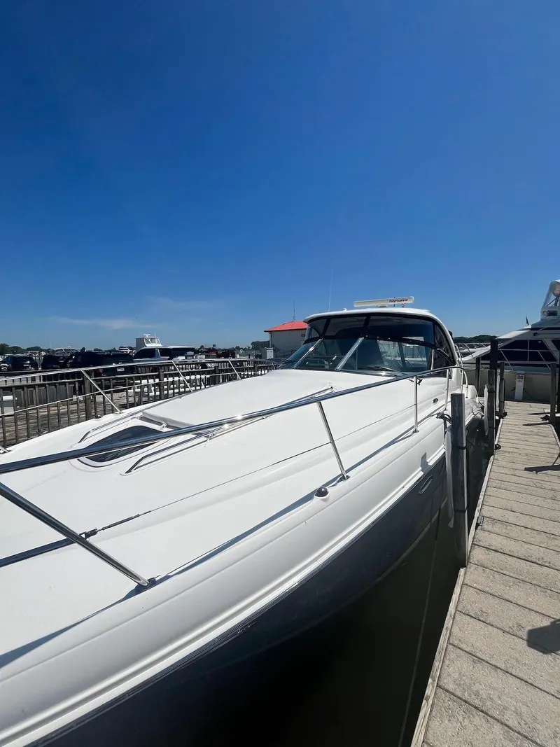 Slide: The Image of 2006 Sea Ray 38 Sundancer docked at marina under clear blue sky. - 4