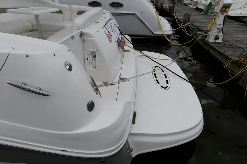 Slide: The Image of 2006 Sea Ray 320 Sundancer docked at marina, rear view. - 11