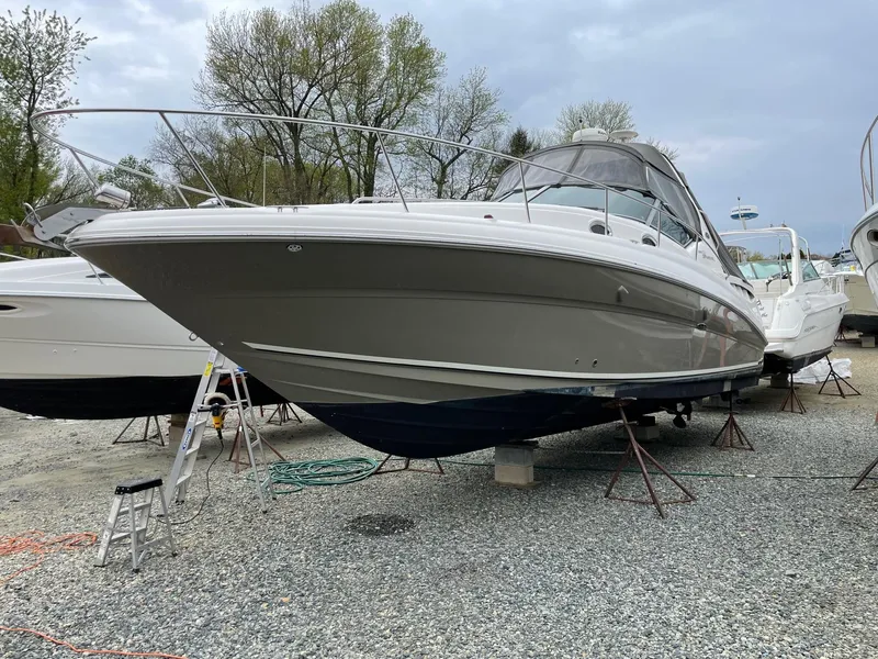 Slide: The Image of 2006 Sea Ray 320 Sundancer boat on dry dock for maintenance. - 2