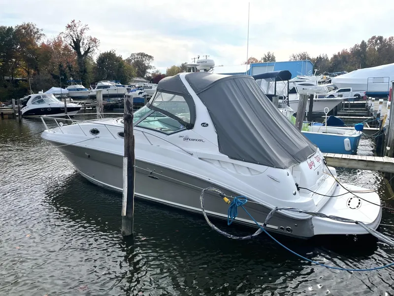 Slide: The Image of 2006 Sea Ray 320 Sundancer docked at a marina. - 3