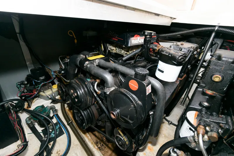 Slide: The Image of Engine compartment of a 1997 Donzi 3250 LXC boat, showcasing mechanical components. - 20