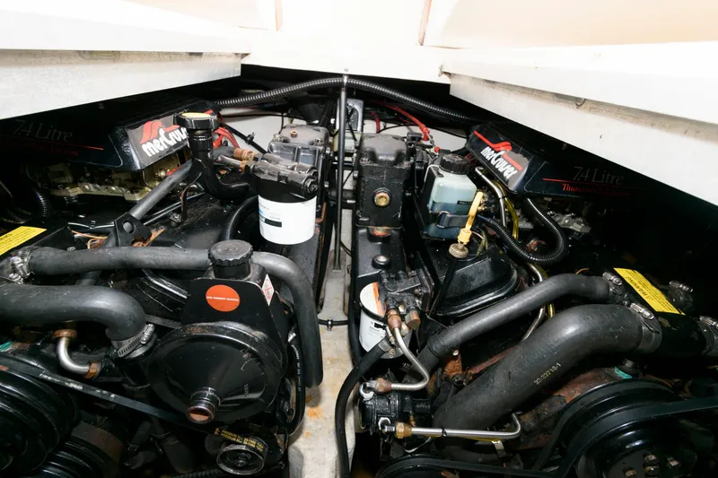 Slide: The Image of Engine compartment of a 1997 Donzi 3250 LXC boat, featuring dual MerCruiser engines. - 21