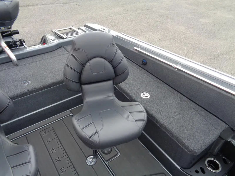 Slide: The Image of 2024 Nitro ZV21 Pro boat interior with cushioned seating and storage compartments. - 14