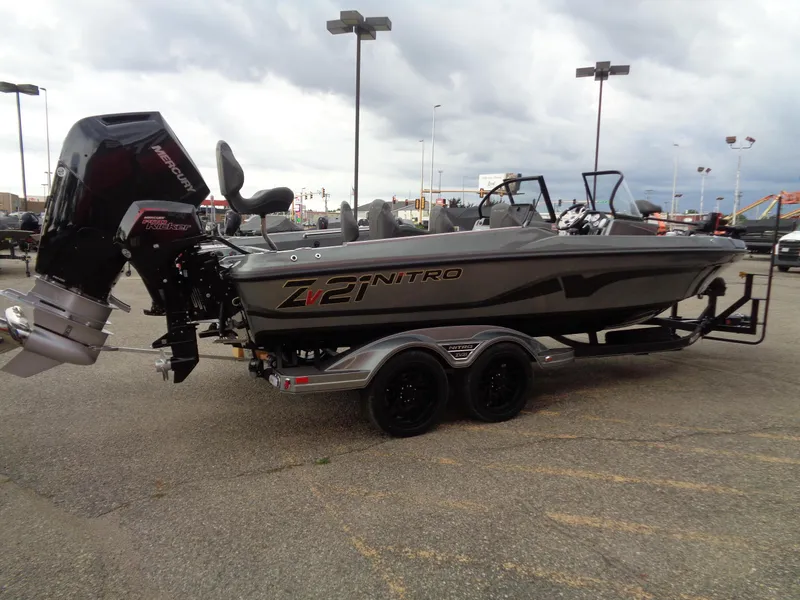 Slide: The Image of 2024 Nitro ZV21 Pro fishing boat with trailer in parking lot. - 3