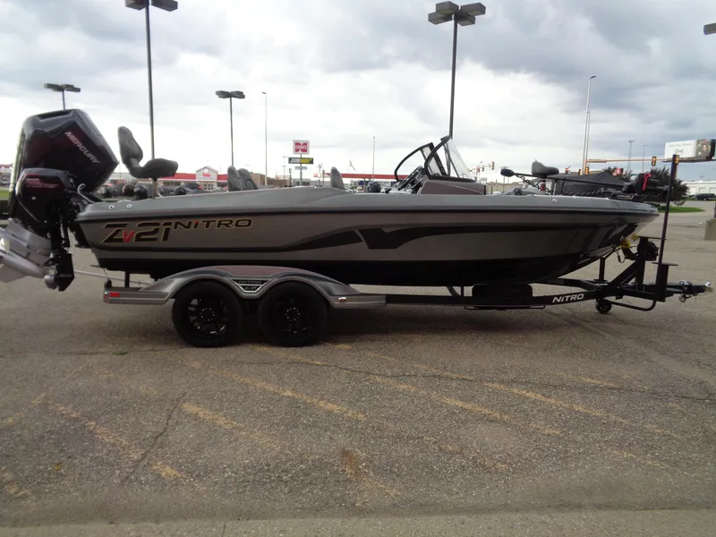 Slide: The Image of 2024 Nitro ZV21 Pro fishing boat on a trailer in a parking lot. - 4