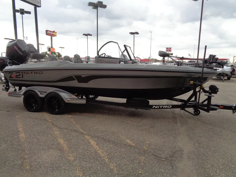 Slide: The Image of 2024 Nitro ZV21 Pro fishing boat on trailer in parking lot. - 5