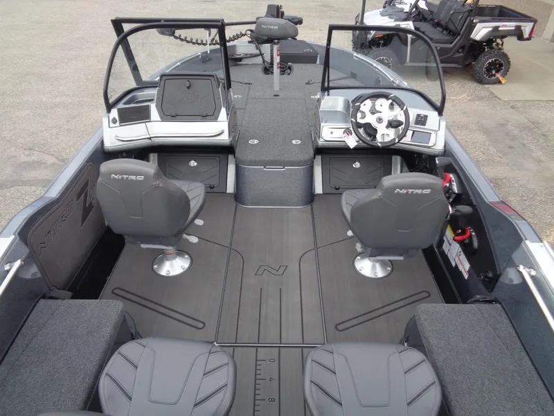 Slide: The Image of 2024 Nitro ZV21 Pro boat interior with seating and control console. - 6
