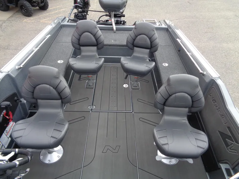 Slide: The Image of 2024 Nitro ZV21 Pro boat interior with four black seats. - 7