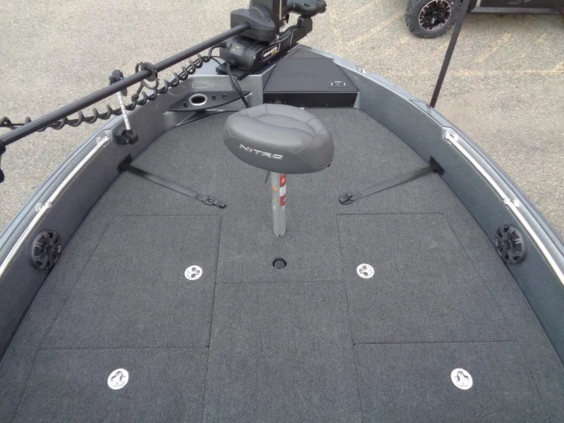 Slide: The Image of 2024 Nitro ZV21 Pro fishing boat deck with seat and storage compartments. - 8