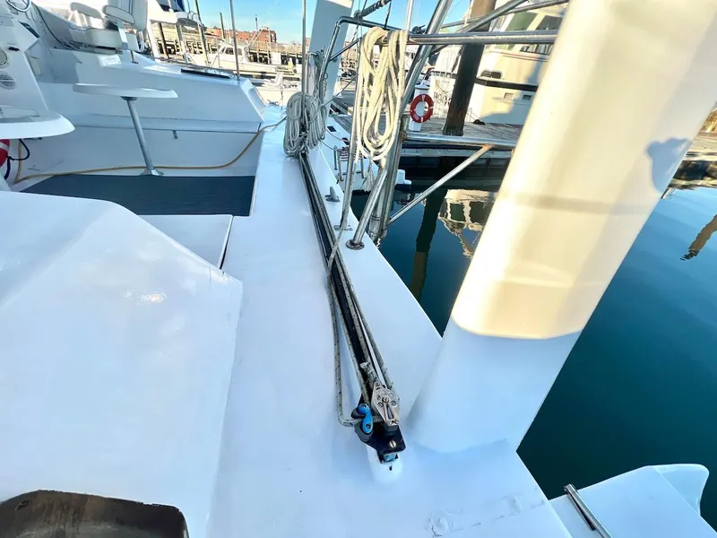 Slide: The Image of Deck view of a 2007 Farrier F-41 catamaran docked at a marina. - 10