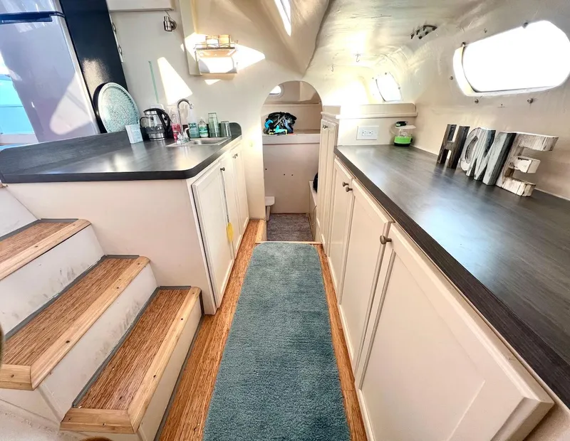 Slide: The Image of Modern Farrier F-41 2007 yacht interior with kitchen, wooden steps, and HOME decor. - 19