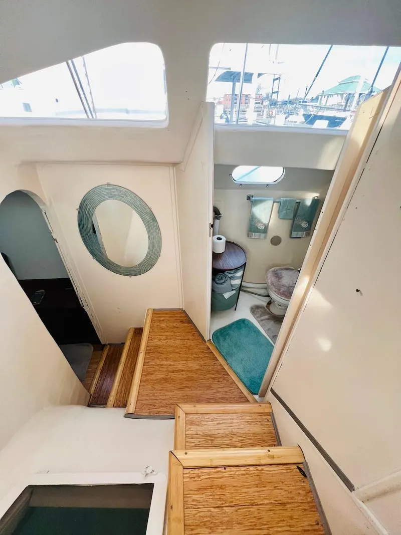 Slide: The Image of Interior of 2007 Farrier F-41 sailboat with wooden stairs and bathroom. - 29