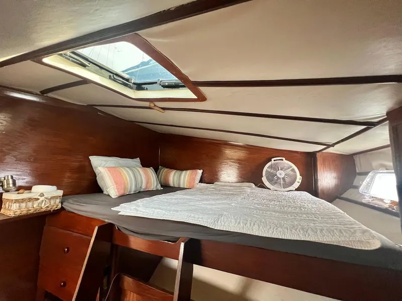 Slide: The Image of Cozy cabin interior of 2007 Farrier F-41 sailboat with bed, pillows, and fan. - 34