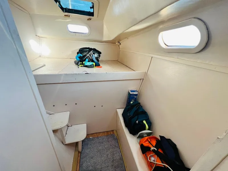 Slide: The Image of Interior cabin of a 2007 Farrier F-41 sailboat with storage and seating. - 45