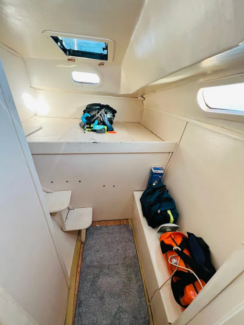 Slide: The Image of Interior cabin of a 2007 Farrier F-41 sailboat with storage and seating. - 46