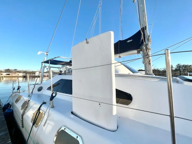 Slide: The Image of Farrier F-41 2007 sailboat docked, showing deck and rigging details. - 6
