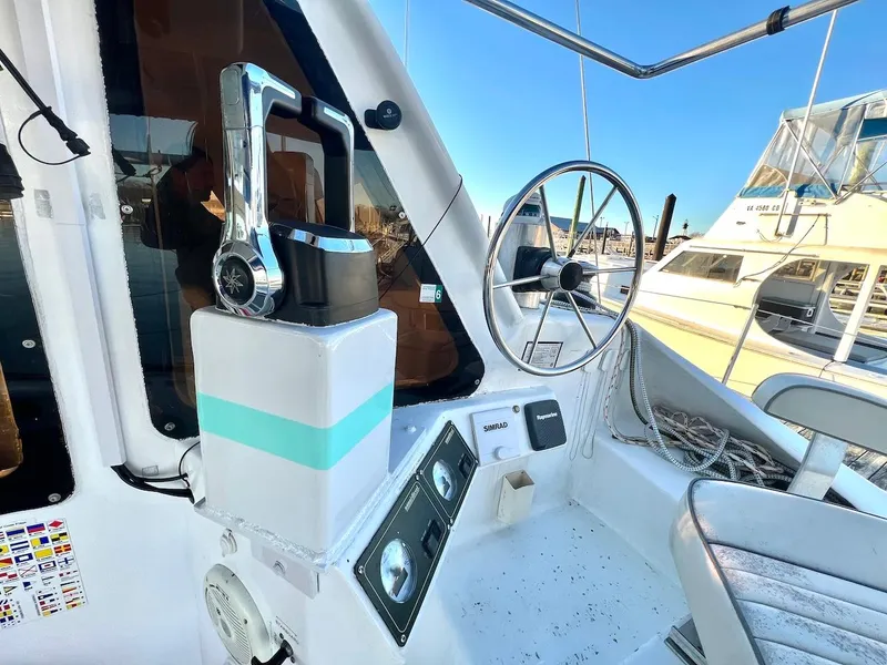 Slide: The Image of Farrier F-41 2007 boat cockpit with steering wheel and control panel. - 7