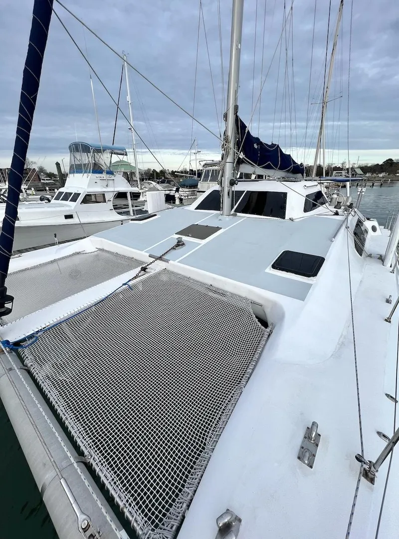 Slide: The Image of 2007 Farrier F-41 catamaran docked at a marina. - 9