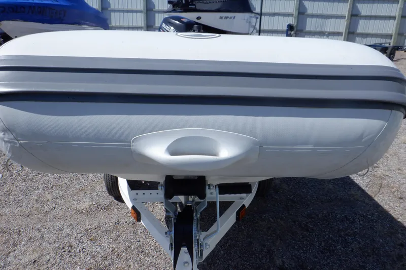 Slide: The Image of Walker Bay 325 STX Odyssey 2015 inflatable boat on trailer, front view. - 21