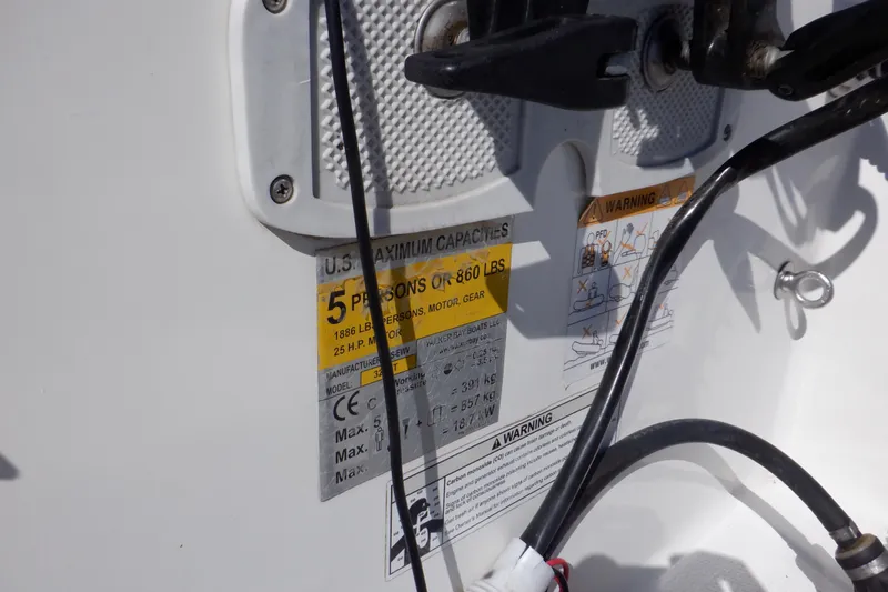 Slide: The Image of 2015 Walker Bay 325 STX Odyssey capacity label, showing maximum 5 persons or 860 lbs. - 27