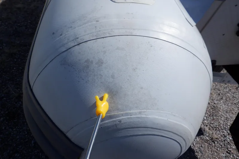 Slide: The Image of 2015 Walker Bay 325 STX Odyssey inflatable boat with a yellow tool on its surface. - 32